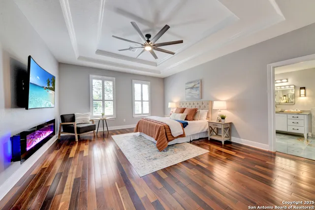 a bedroom with a bed bookshelf and a desk