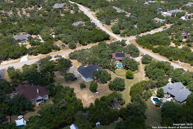 an aerial view of house with yard