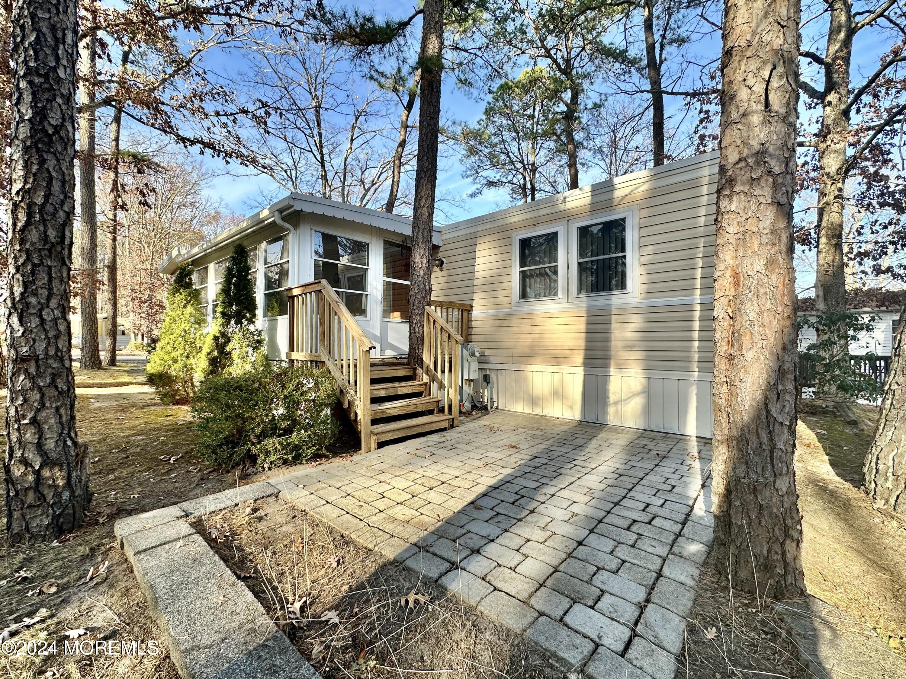 2 Rose Drive Jackson, NJ 08527 - Photo 19 of 20 a front view of a house with garden