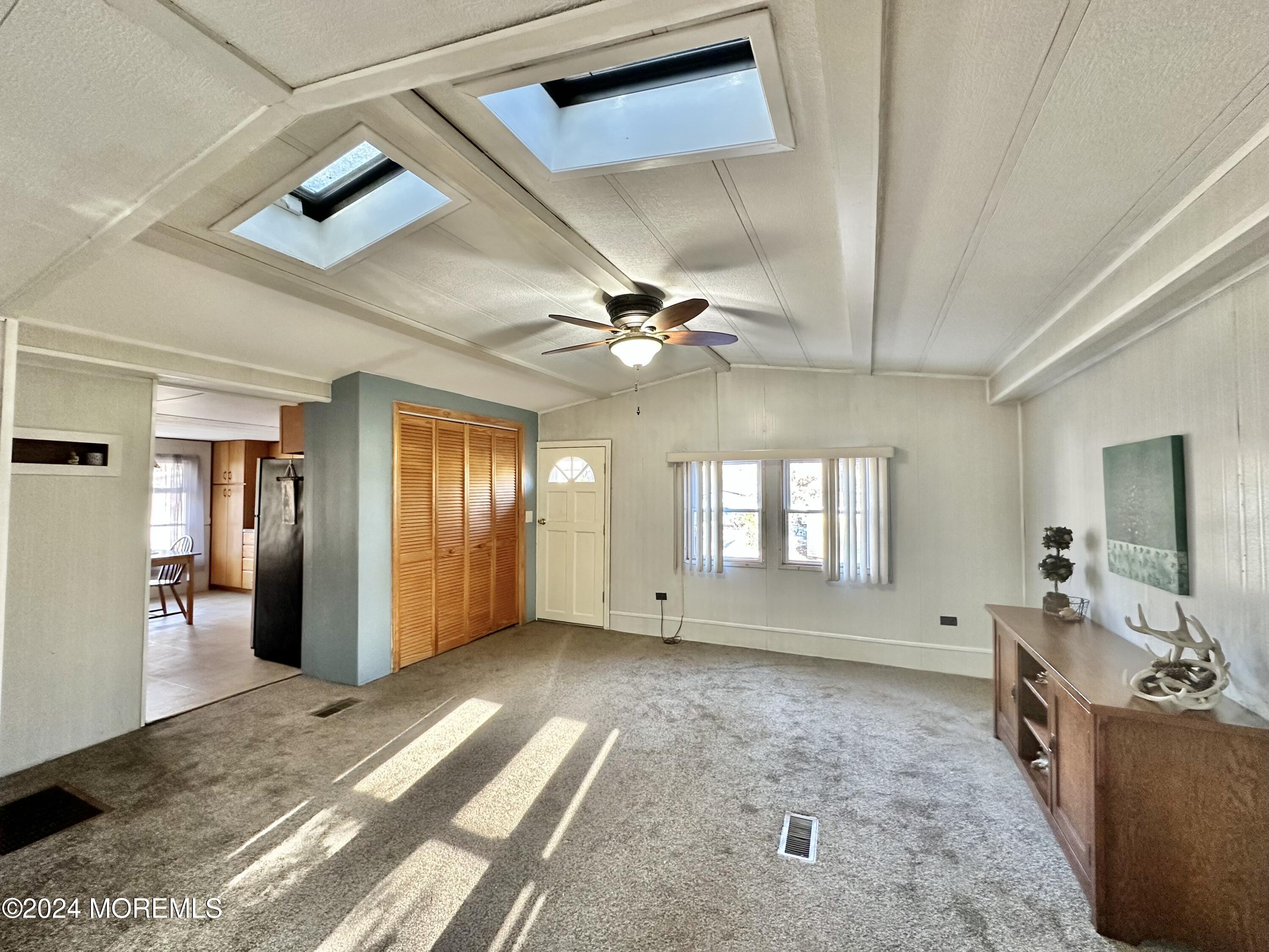 2 Rose Drive Jackson, NJ 08527 - Photo 5 of 20 a view of a livingroom with hardwood floor and a ceiling fan