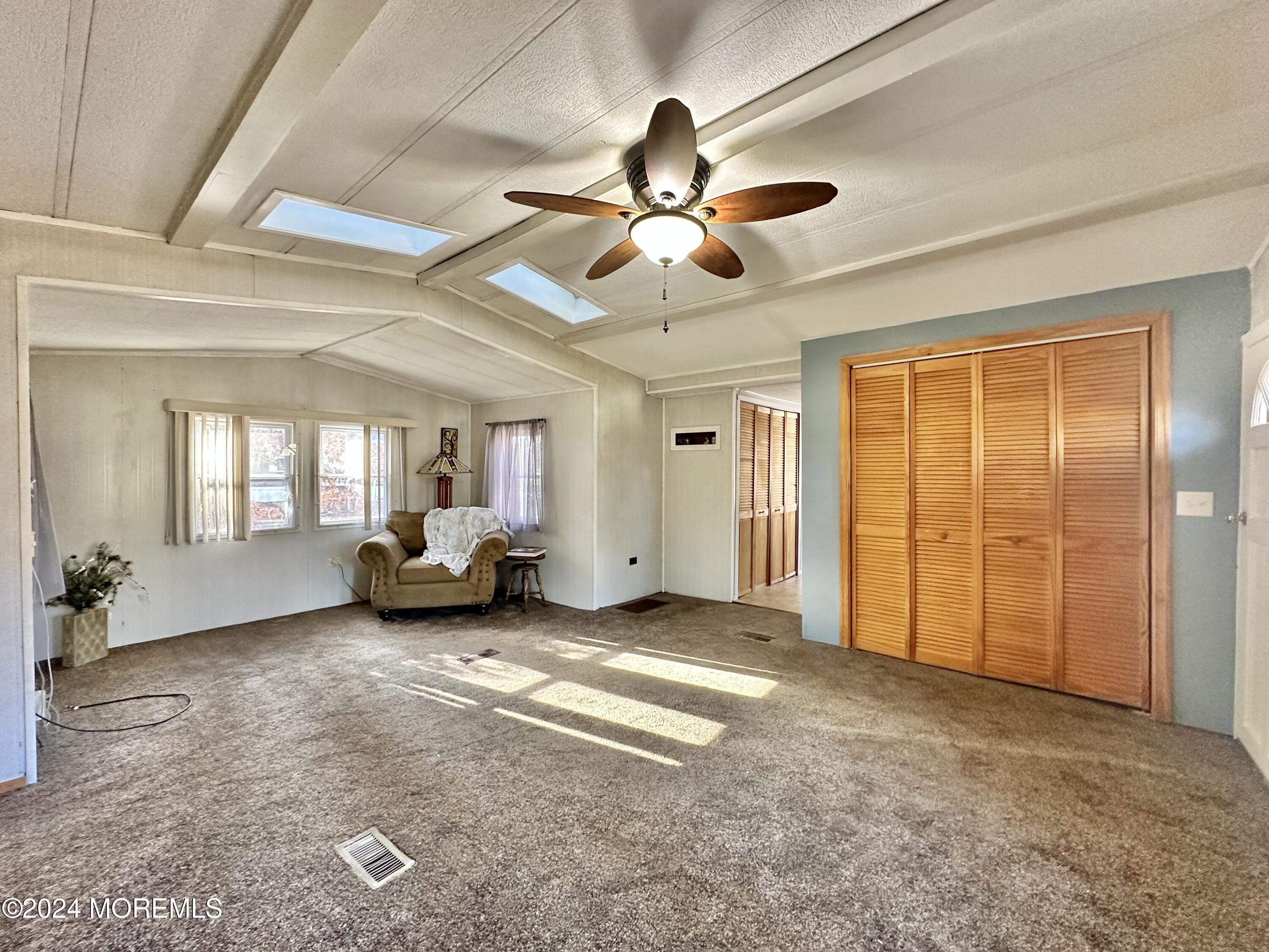 2 Rose Drive Jackson, NJ 08527 - Photo 6 of 20 a view of a livingroom with a ceiling fan and window