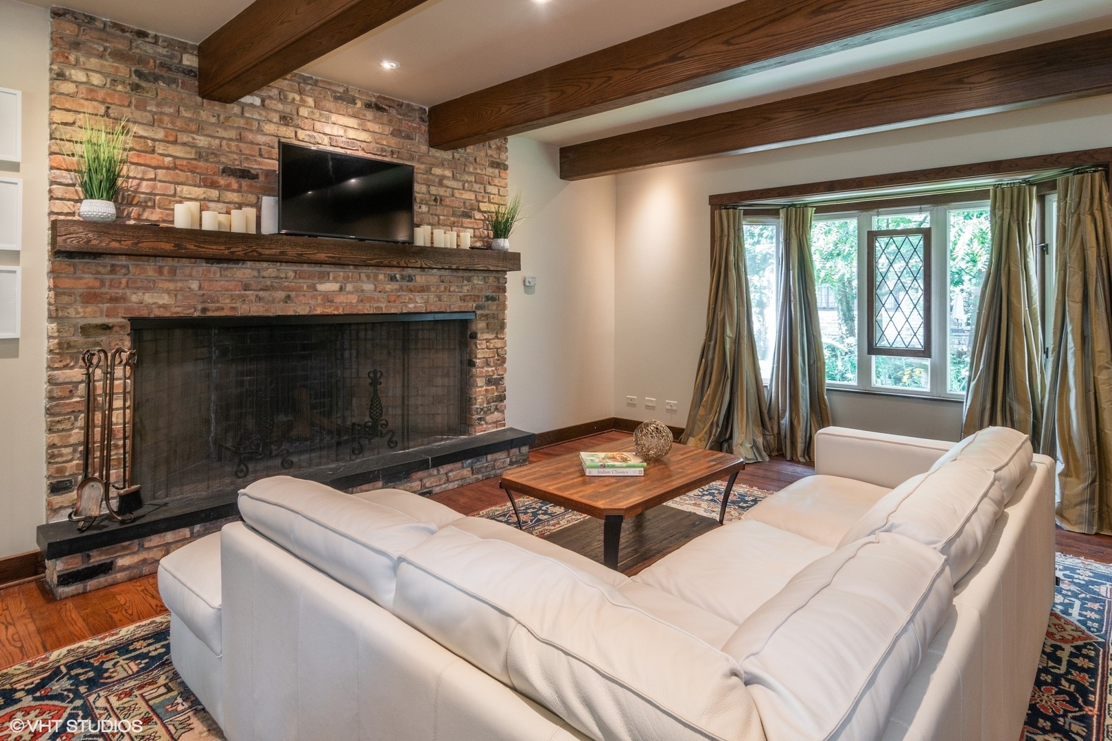 280 Maplewood Road Riverside, IL 60546 - Photo 5 of 30 a living room with furniture a flat screen tv and a fireplace