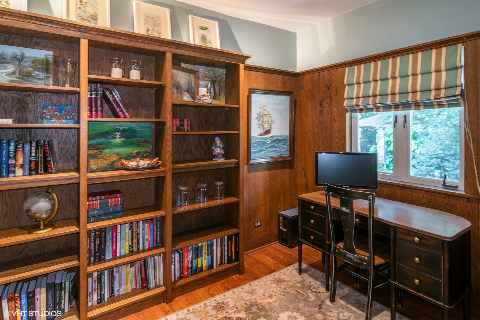 280 Maplewood Road Riverside, IL 60546 - Photo 8 of 30 a view of a workspace with bookshelf and a window