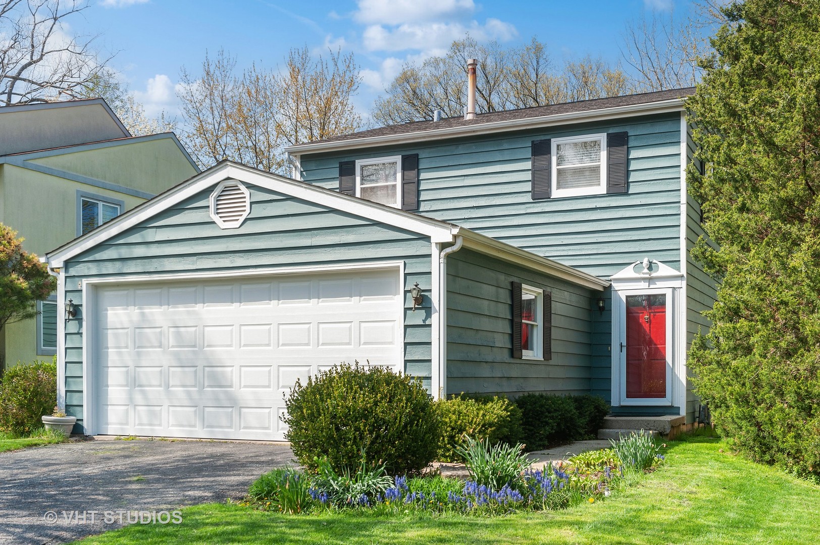 68 West Old Elm Road Lake Forest, IL 60045 - Photo 15 of 19 a front view of a house with garden