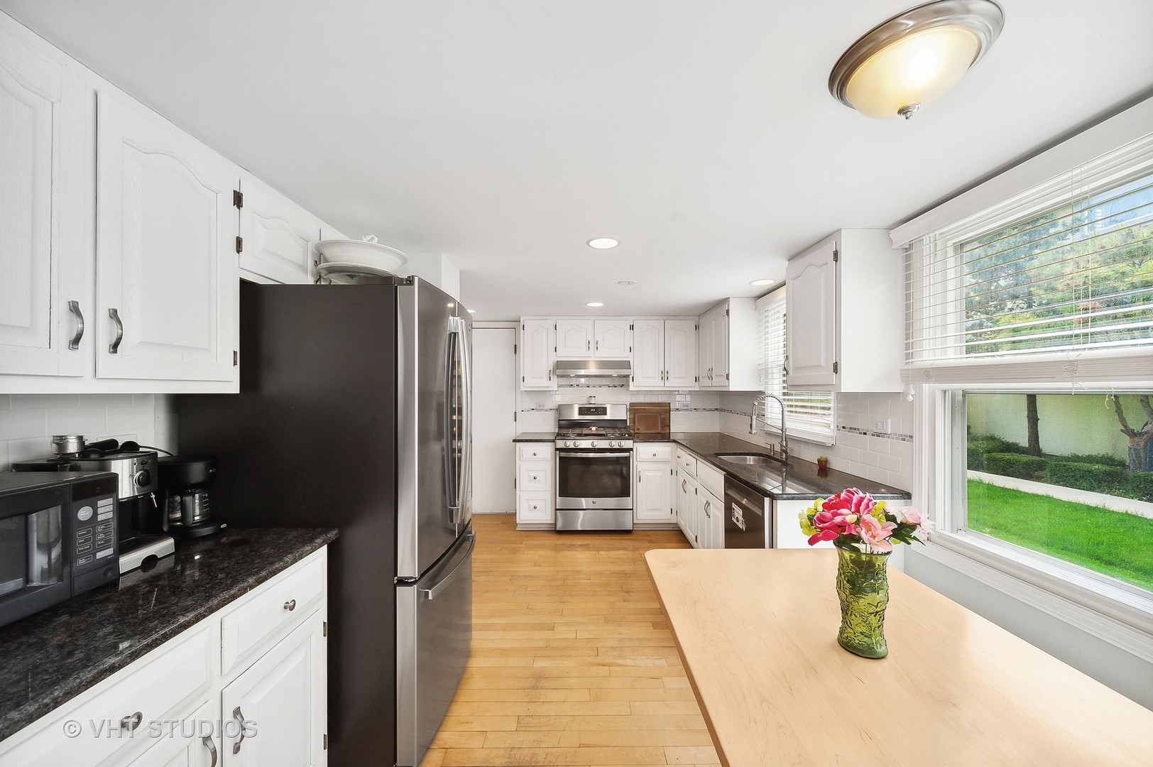 68 West Old Elm Road Lake Forest, IL 60045 - Photo 6 of 19 a kitchen with a refrigerator and a sink