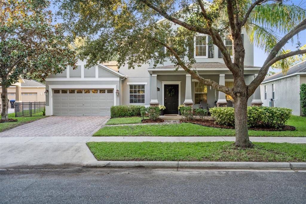 6152 Meriwether Crescent Winter Garden, FL 34787 - Photo 1 of 1 a front view of a house with a yard and potted plants