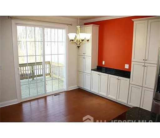 a black and white photo of a living room