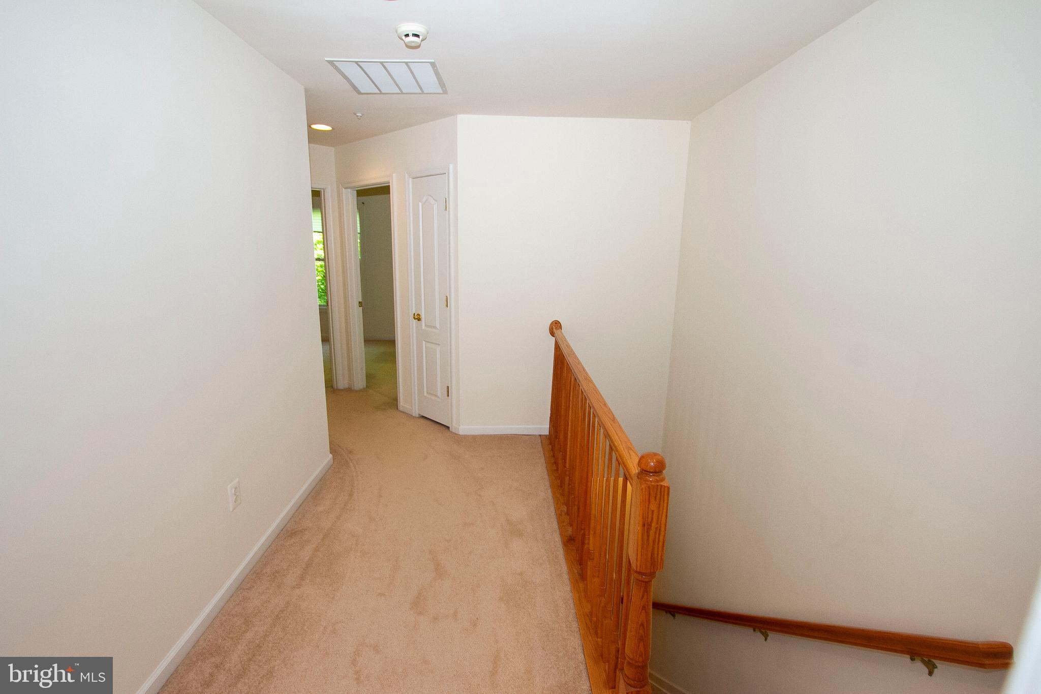 10206 Rutland Round Road, Unit 74 Columbia, MD 21044 - Photo 22 of 37 Carpeted hallway - Upper level