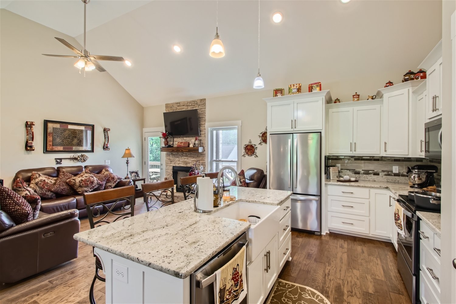 190 Mitchell Road Portland, TN 37148 - Photo 11 of 28 a kitchen with stainless steel appliances granite countertop a stove refrigerator and couches