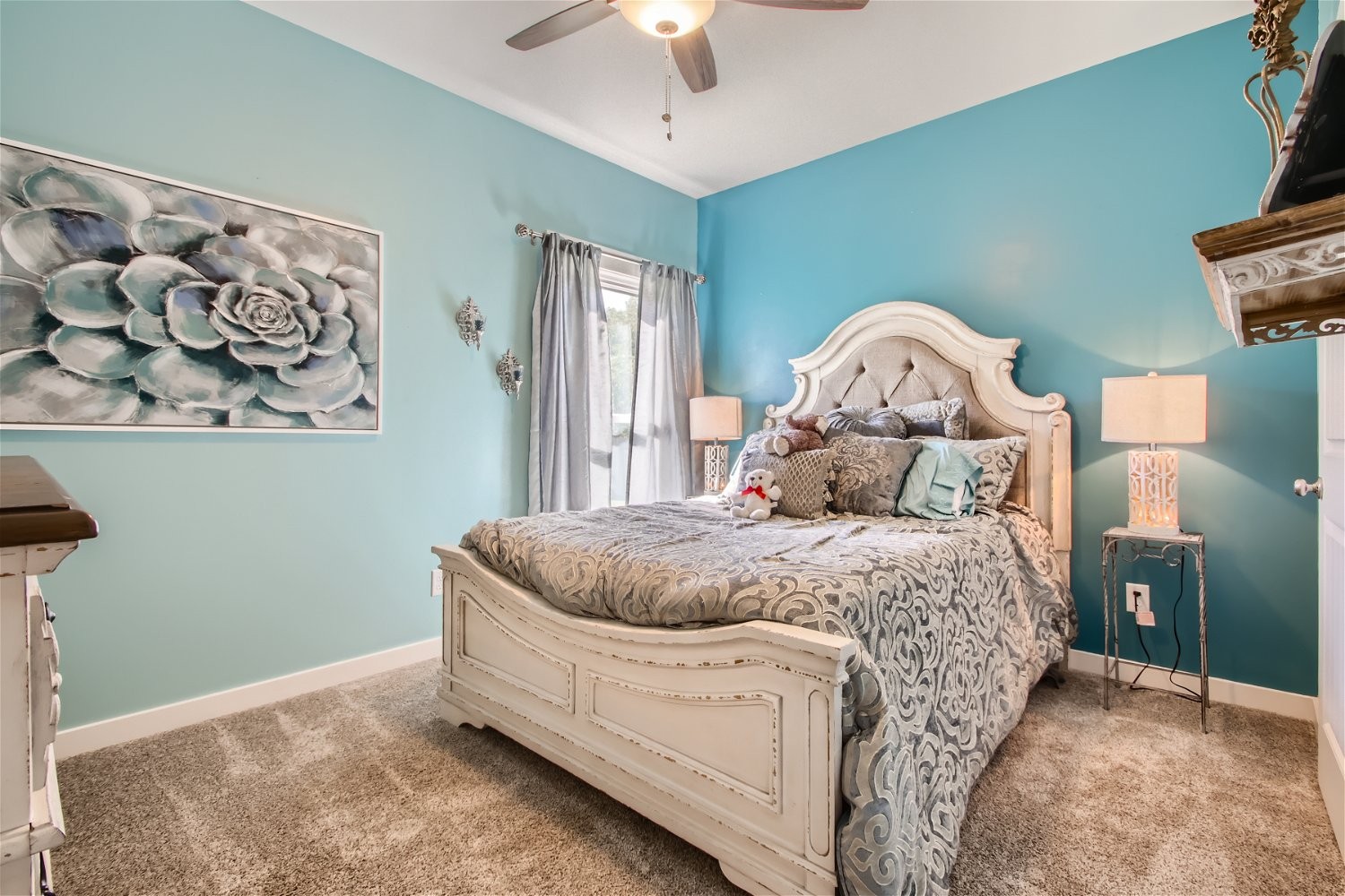 190 Mitchell Road Portland, TN 37148 - Photo 22 of 28 a spacious bedroom with a bed and a chandelier