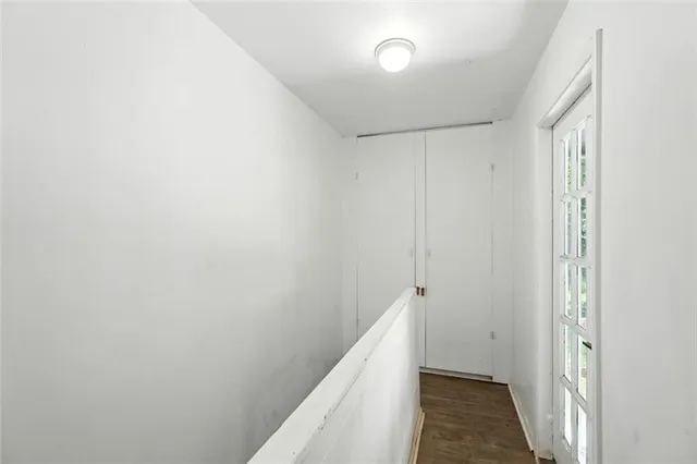 a view of hallway with closet