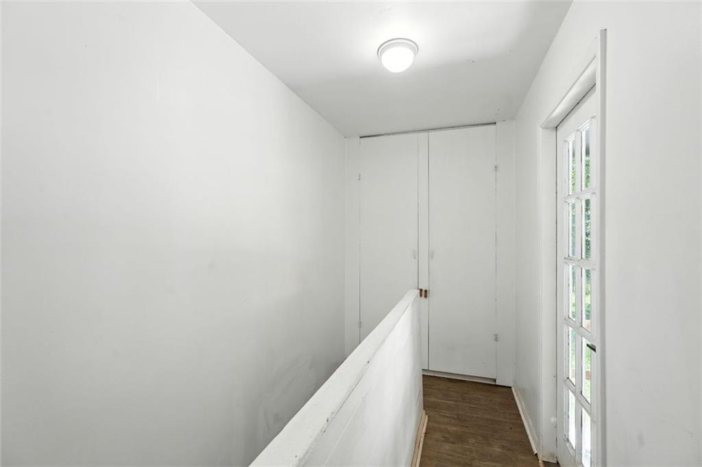 a view of hallway with closet