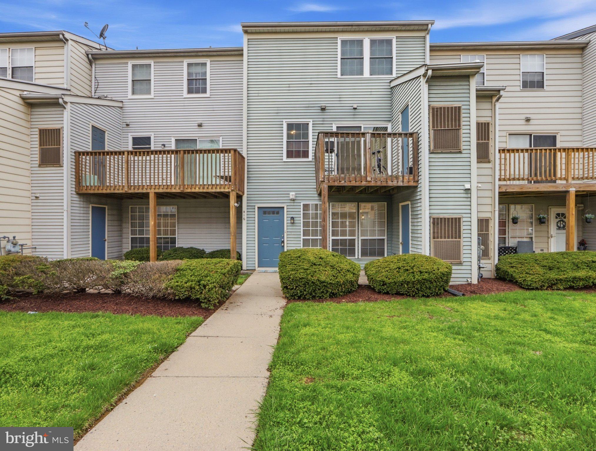 416 Terry Court, Unit A3 Frederick, MD 21701 - Photo 1 of 29 a front view of a house with a garden