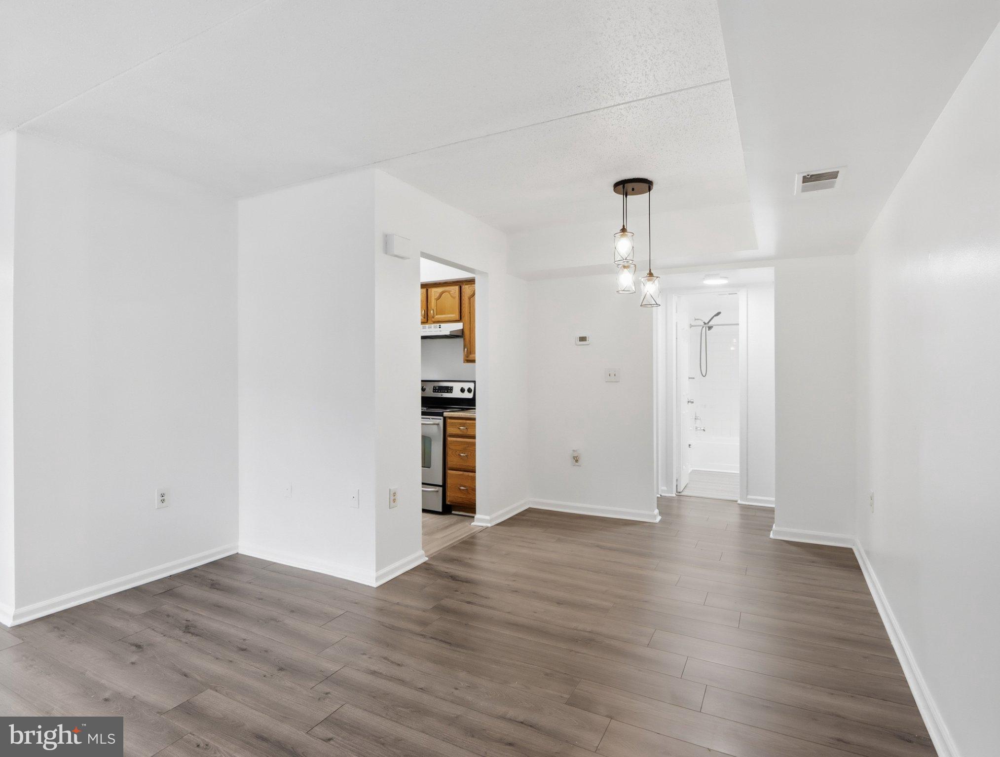 416 Terry Court, Unit A3 Frederick, MD 21701 - Photo 11 of 29 an empty room with wooden floor and closet