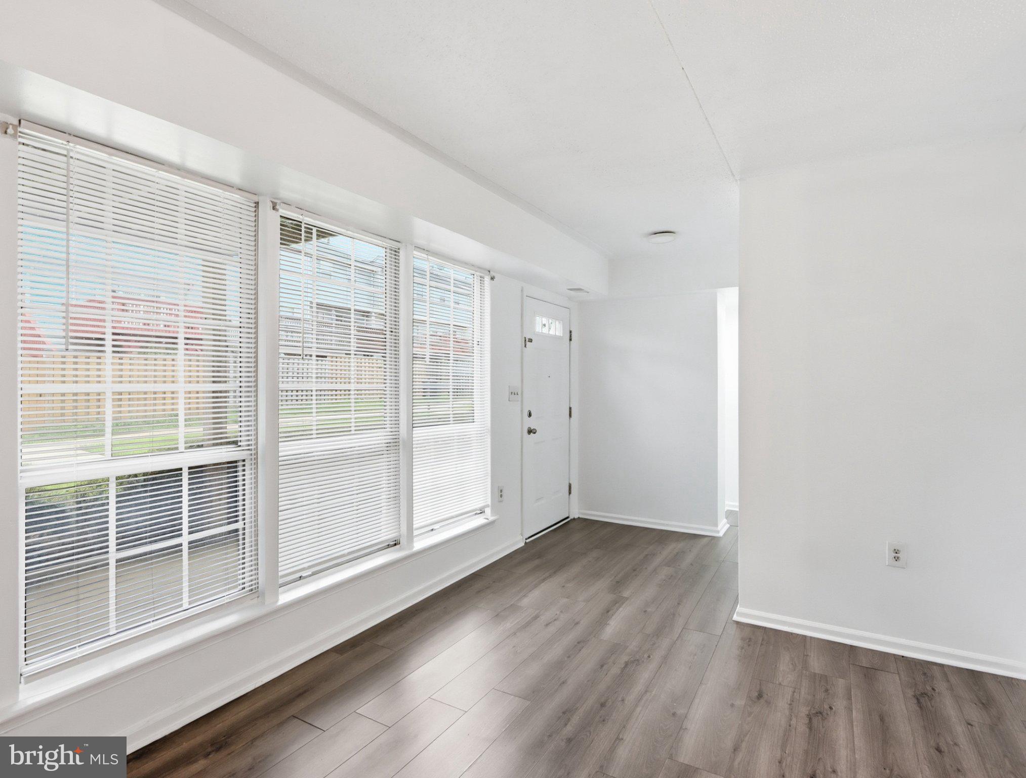 416 Terry Court, Unit A3 Frederick, MD 21701 - Photo 12 of 29 a view of wooden floor and windows in a room