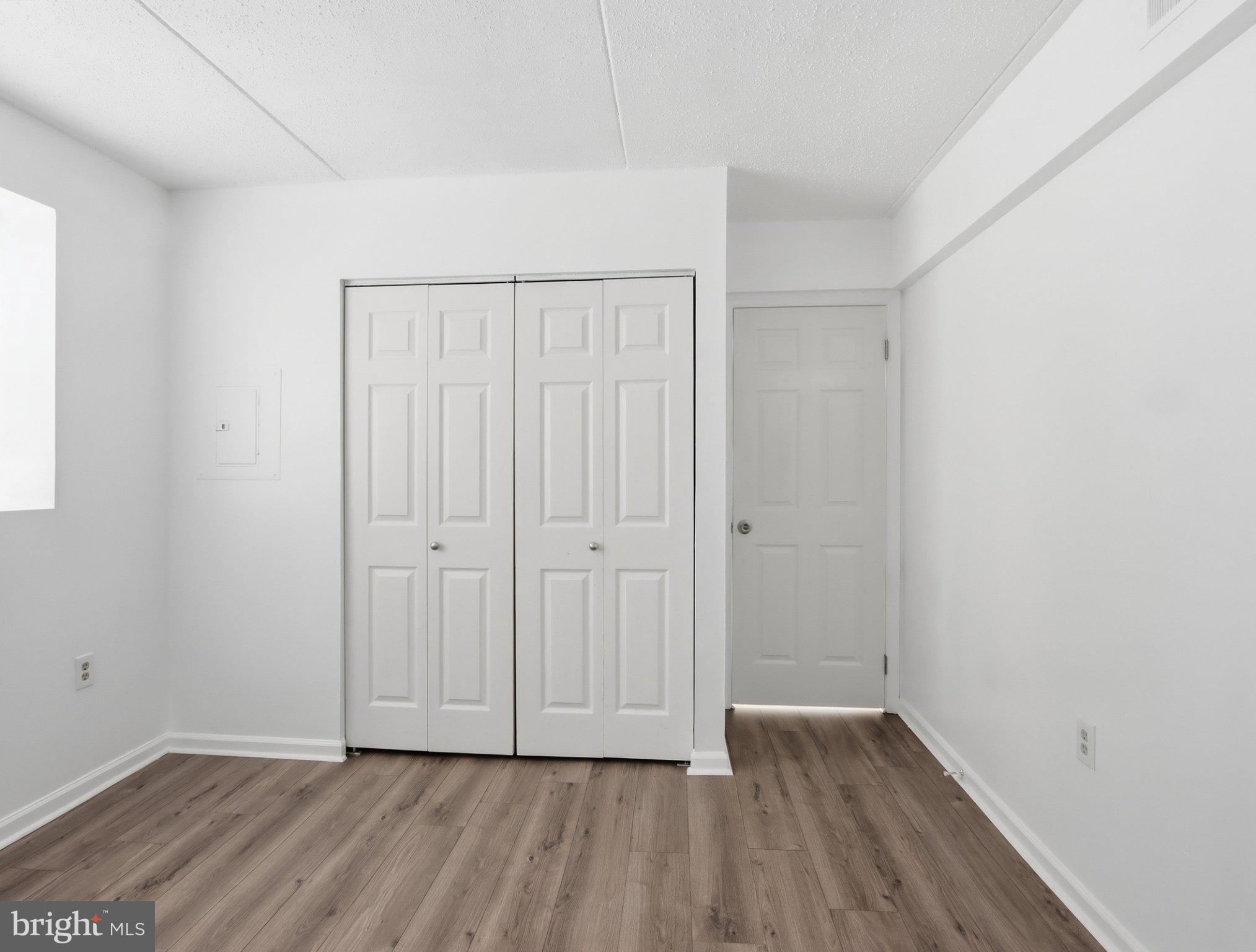 416 Terry Court, Unit A3 Frederick, MD 21701 - Photo 19 of 29 a view of an empty room with wooden floor
