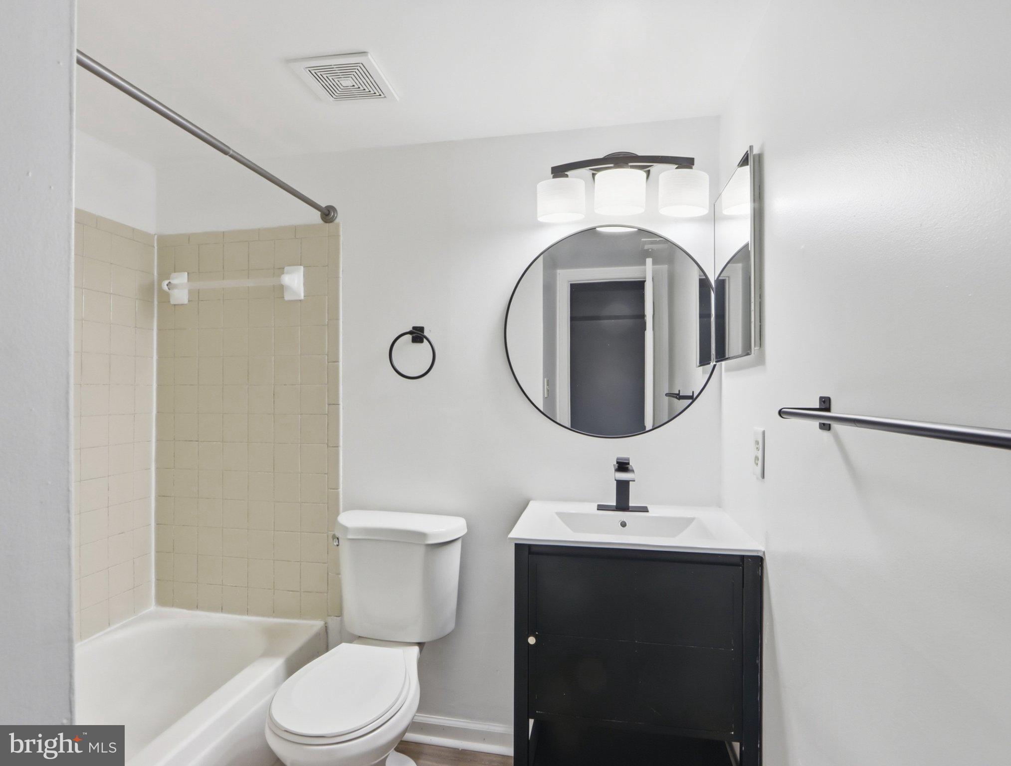 416 Terry Court, Unit A3 Frederick, MD 21701 - Photo 24 of 29 a bathroom with a toilet sink and mirror