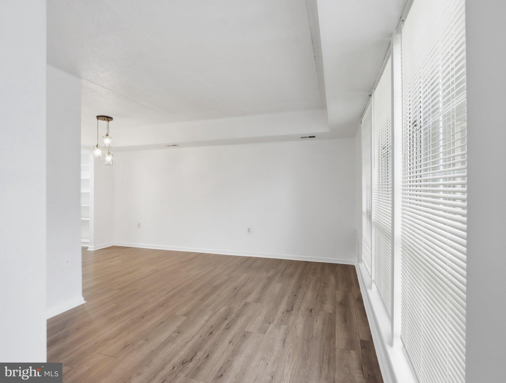 416 Terry Court, Unit A3 Frederick, MD 21701 - Photo 26 of 29 a view of a small space with wooden floor and a window