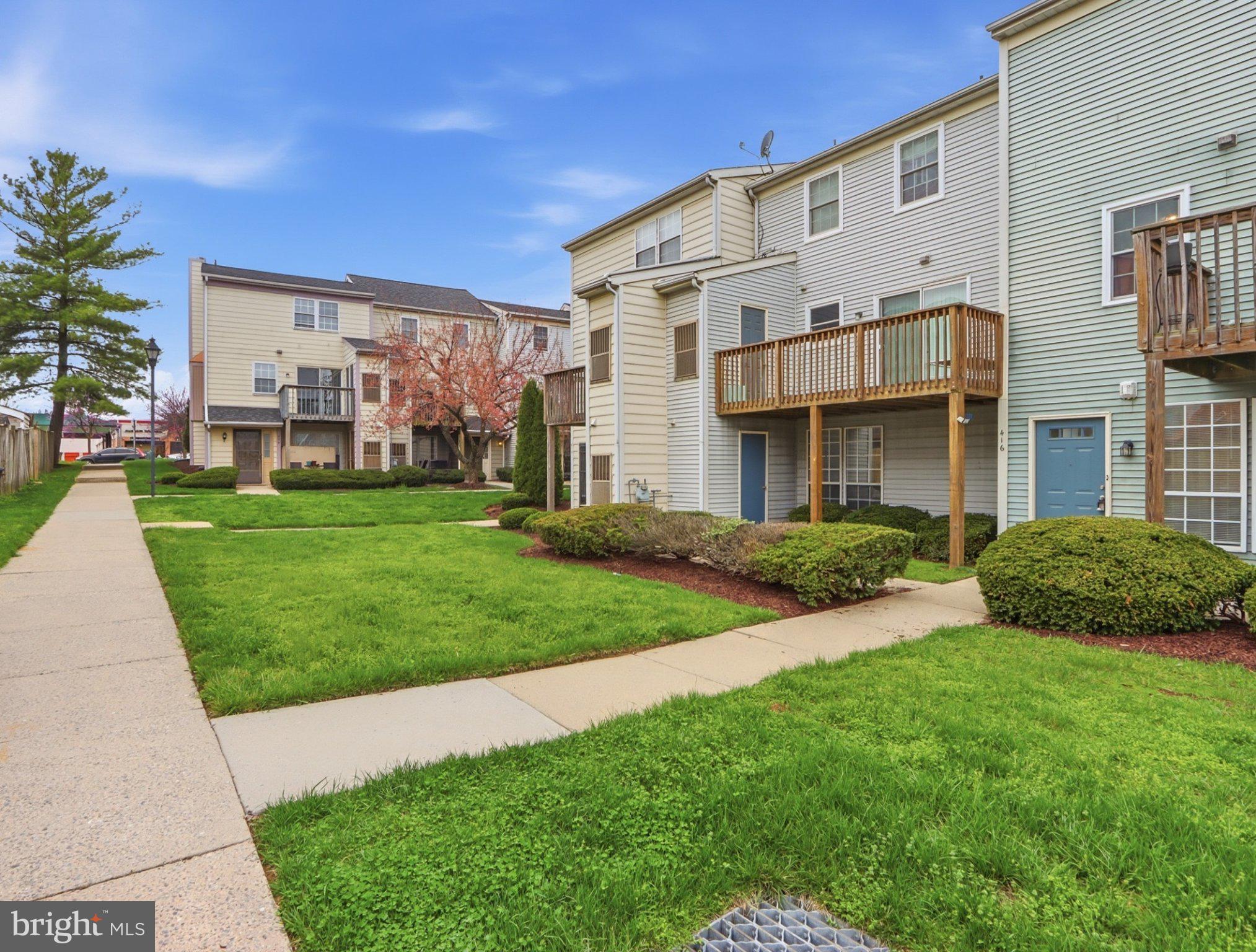416 Terry Court, Unit A3 Frederick, MD 21701 - Photo 28 of 29 a view of a building with a yard