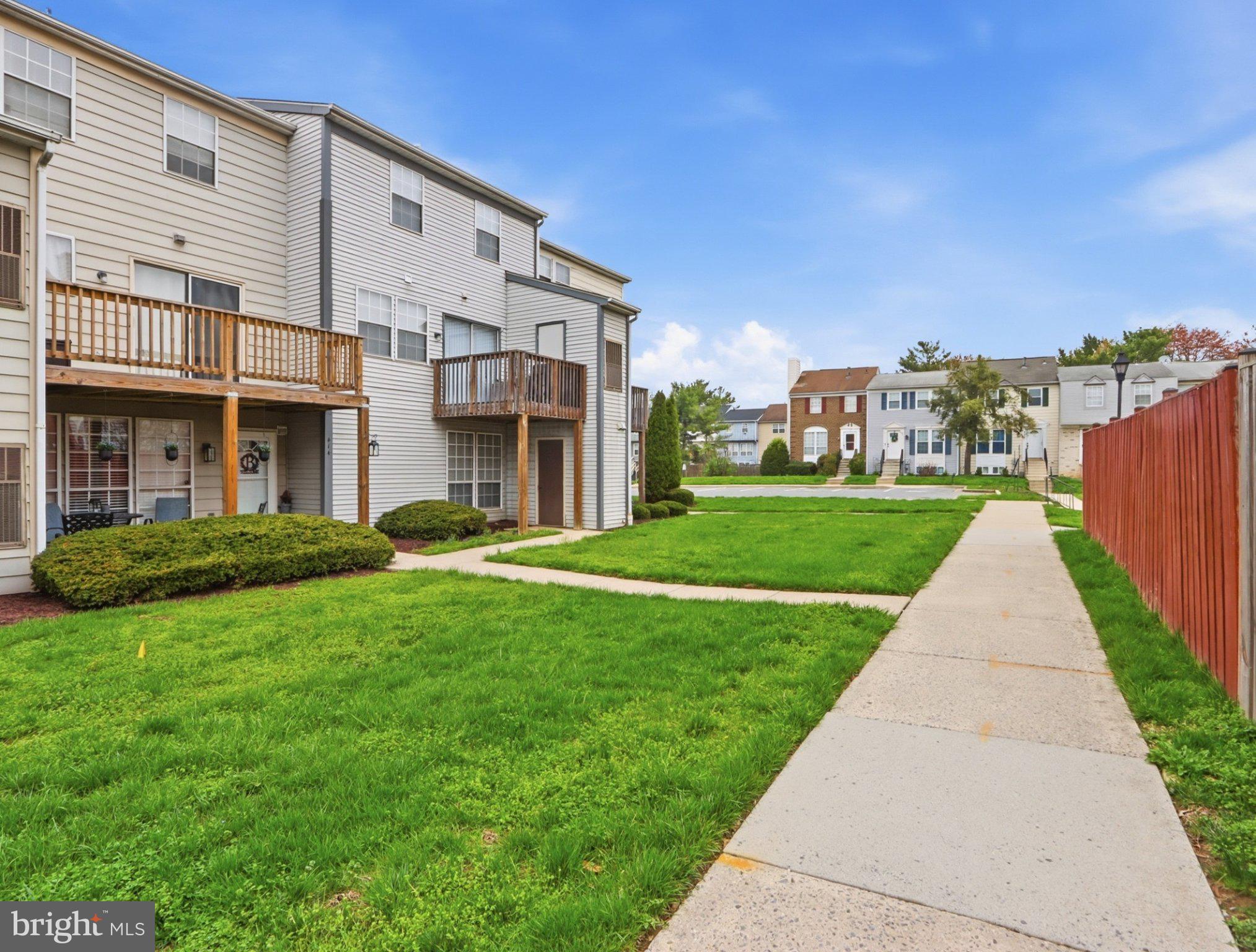 416 Terry Court, Unit A3 Frederick, MD 21701 - Photo 29 of 29 a front view of a building with a yard
