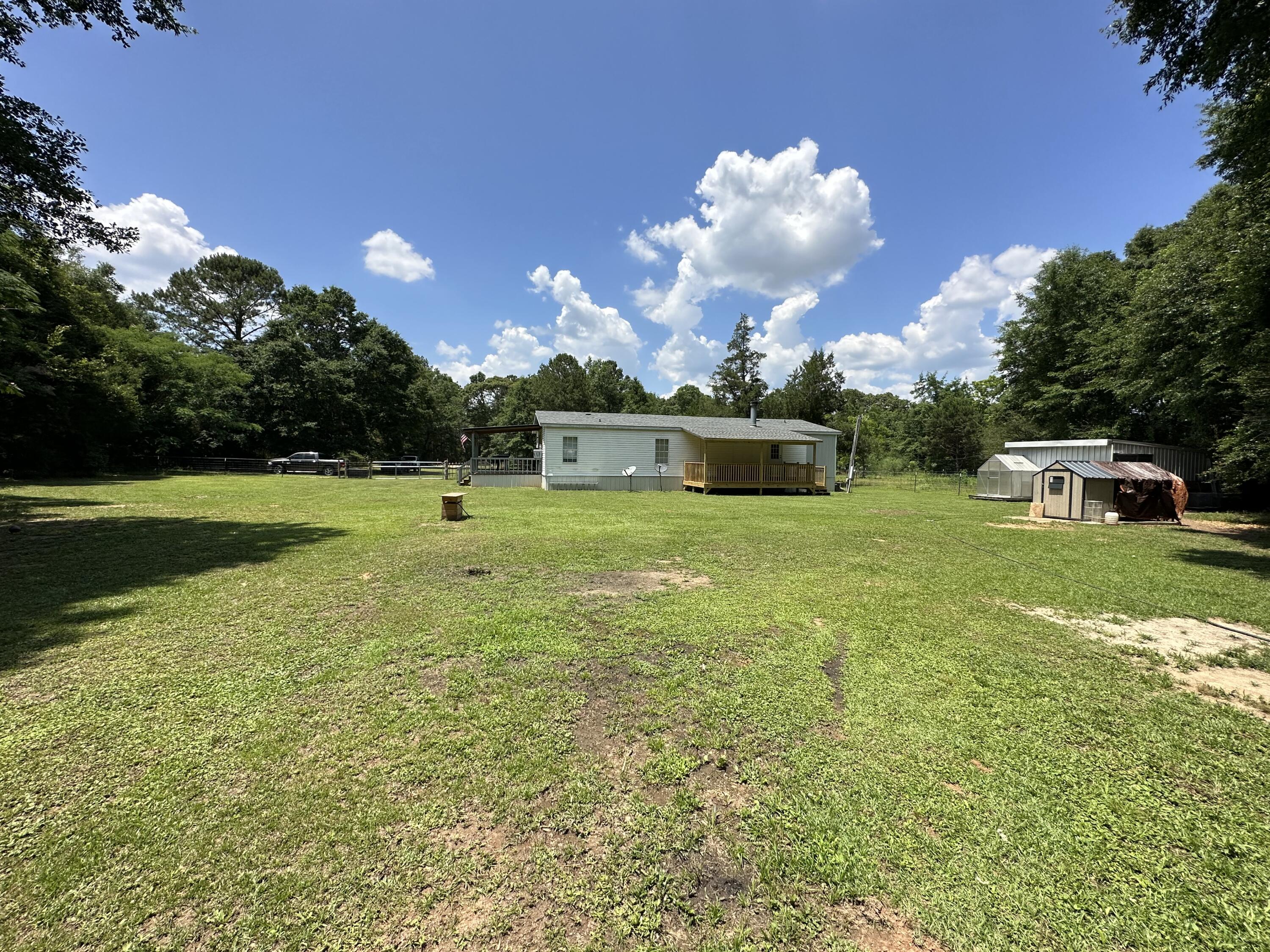 5389 Dodson Road Baker, FL 32531 - Photo 8 of 43 a view of a golf course with a swimming pool
