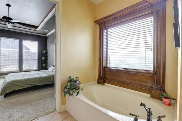 a bathroom with a tub and a sink