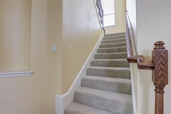 a view of staircase with white walls