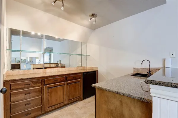 a kitchen with sink and stove