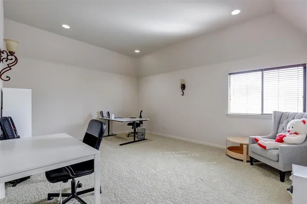 a bedroom with furniture and a window