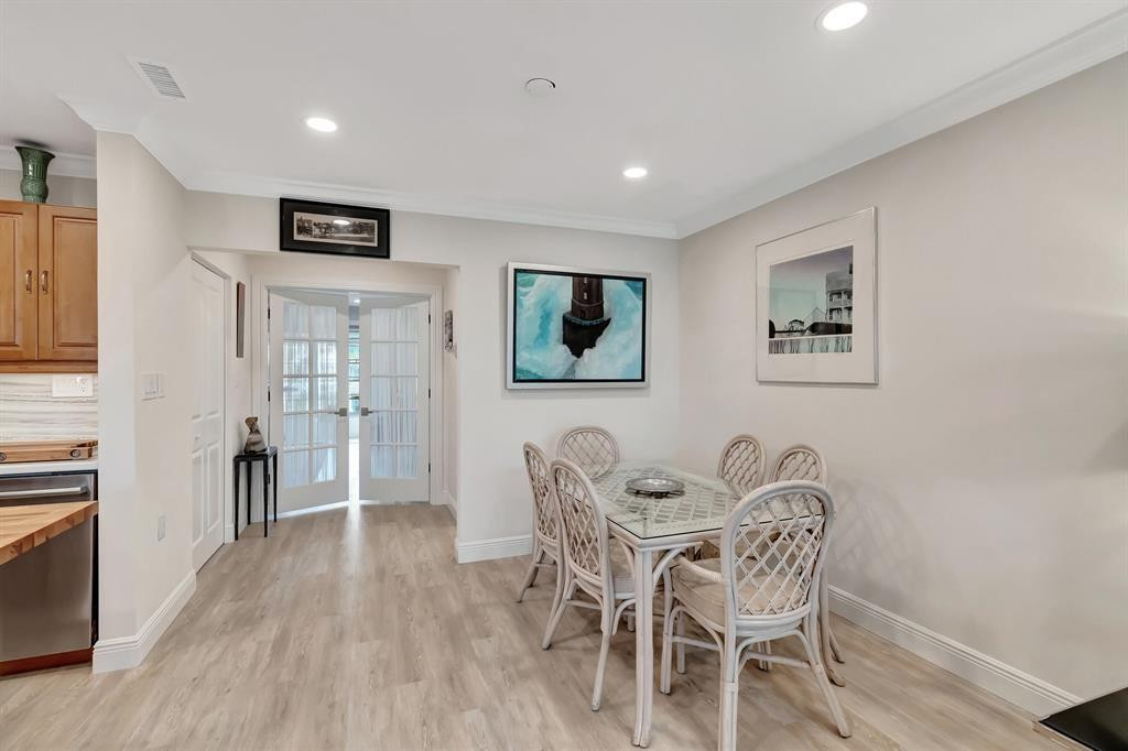 5520 North Ocean Boulevard, Unit 210 Ocean Ridge, FL 33435 - Photo 12 of 40 a view of a livingroom with furniture and wooden floor