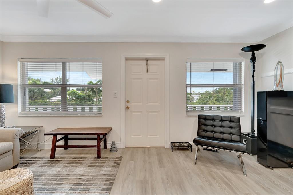 5520 North Ocean Boulevard, Unit 210 Ocean Ridge, FL 33435 - Photo 13 of 40 a living room with furniture and a window