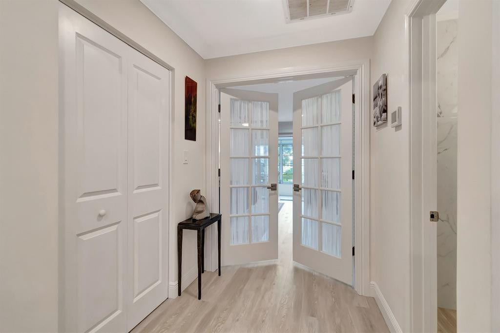 5520 North Ocean Boulevard, Unit 210 Ocean Ridge, FL 33435 - Photo 16 of 40 a view of empty room with wooden floor and entryway