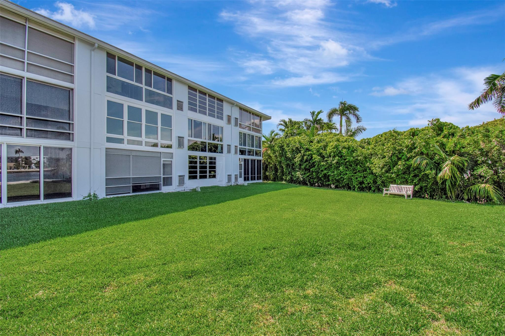 5520 North Ocean Boulevard, Unit 210 Ocean Ridge, FL 33435 - Photo 26 of 40 a view of building with yard