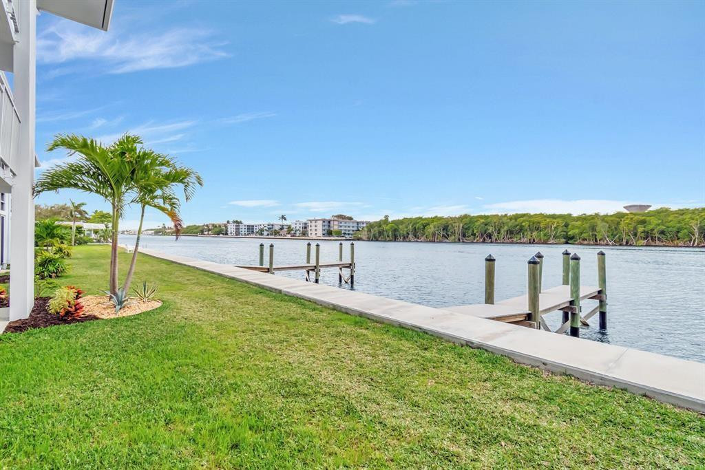 5520 North Ocean Boulevard, Unit 210 Ocean Ridge, FL 33435 - Photo 28 of 40 a view of a lake with houses in the back