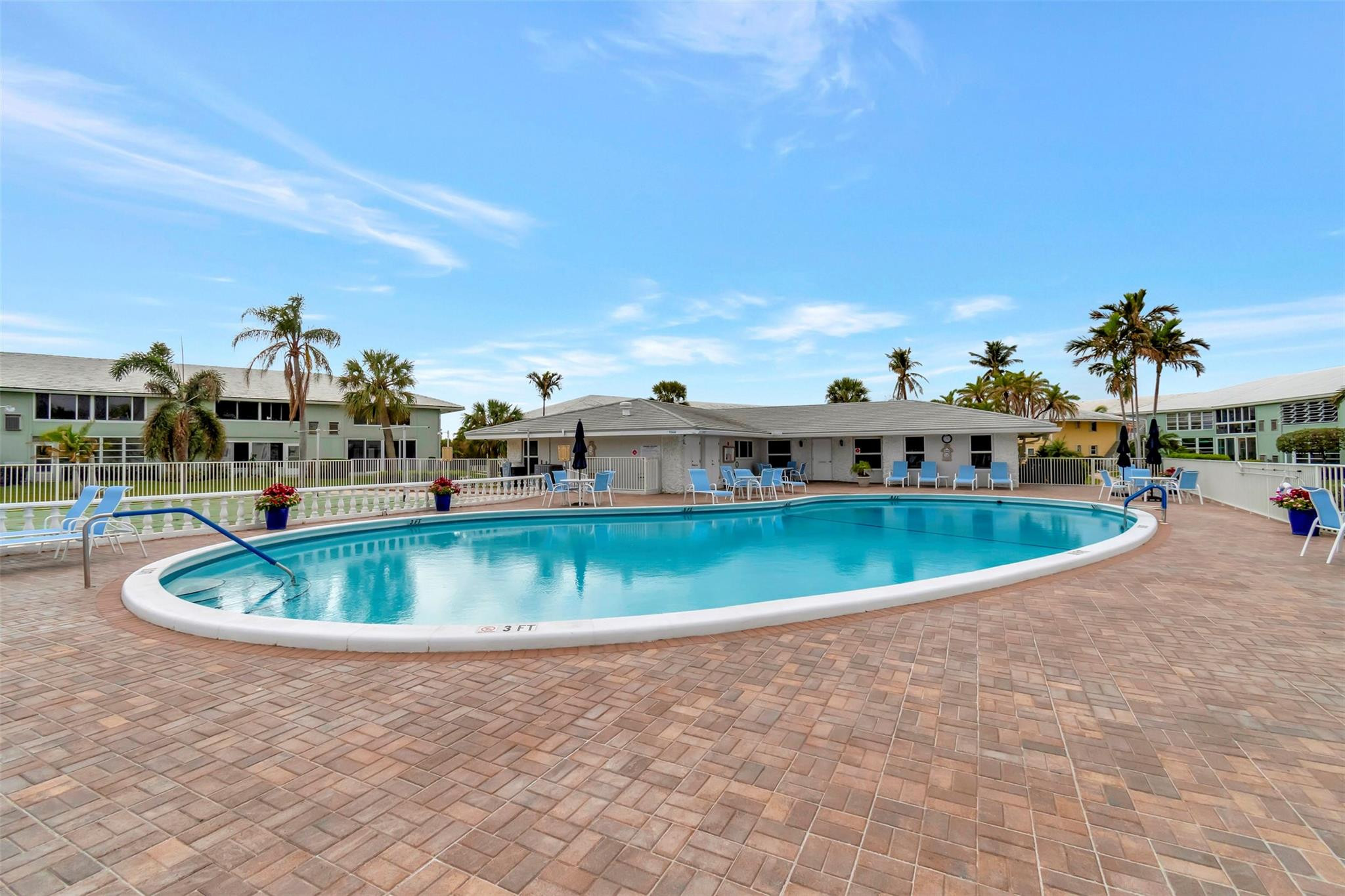 5520 North Ocean Boulevard, Unit 210 Ocean Ridge, FL 33435 - Photo 32 of 40 a view of a swimming pool with a yard
