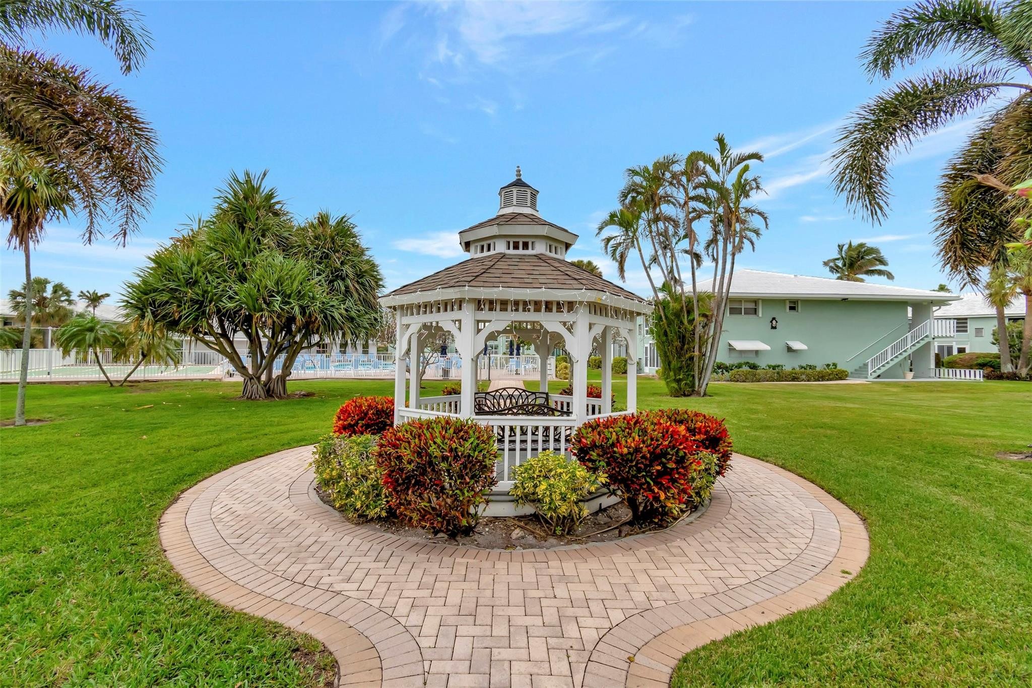 5520 North Ocean Boulevard, Unit 210 Ocean Ridge, FL 33435 - Photo 39 of 40 a front view of a house with garden