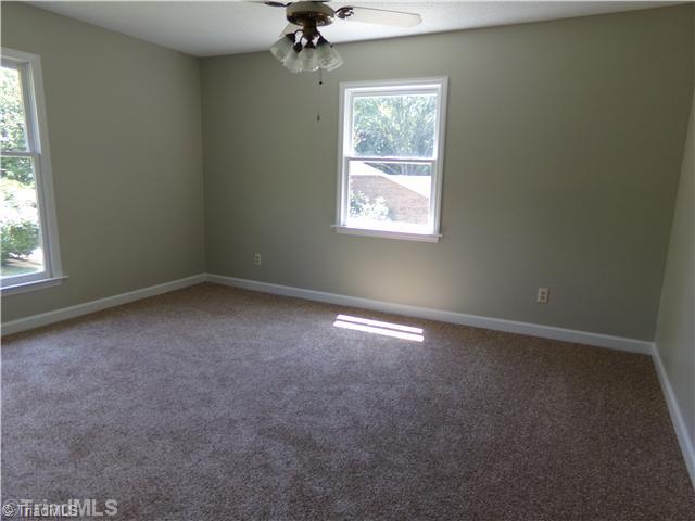 4111 Witherow Road Winston-Salem, NC 27106 - Photo 12 of 16 2nd Bedroom. All bedrooms are quite large and sunny and can accommodate either a queen or king size beds.