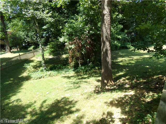 4111 Witherow Road Winston-Salem, NC 27106 - Photo 16 of 16 Yard/Garden. The property is almost a half an acre and most of it is in the fenced-in backyard. A very relaxing place with a beautiful play of sun and shade.