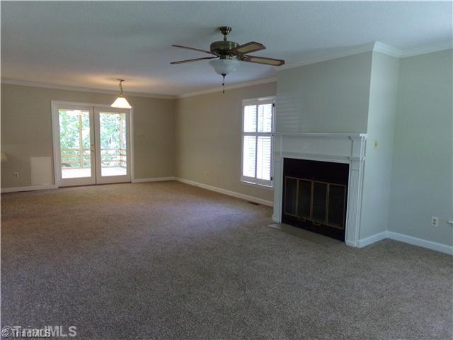 4111 Witherow Road Winston-Salem, NC 27106 - Photo 3 of 16 Den/Family/Great Room. Another view of the living room showing the breakfast area and the French door leading to the large screened-in porch.