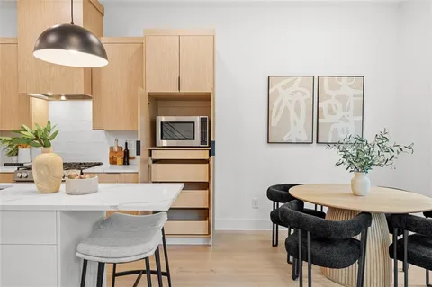 a kitchen with a sink and chandelier