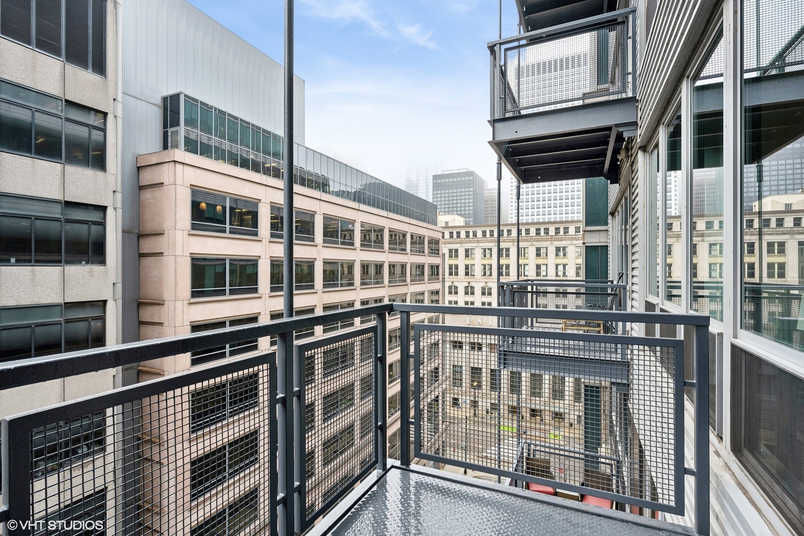 565 West Quincy Street, Unit 902 Chicago, IL 60661 - Photo 13 of 26 a front view of a building with glass windows