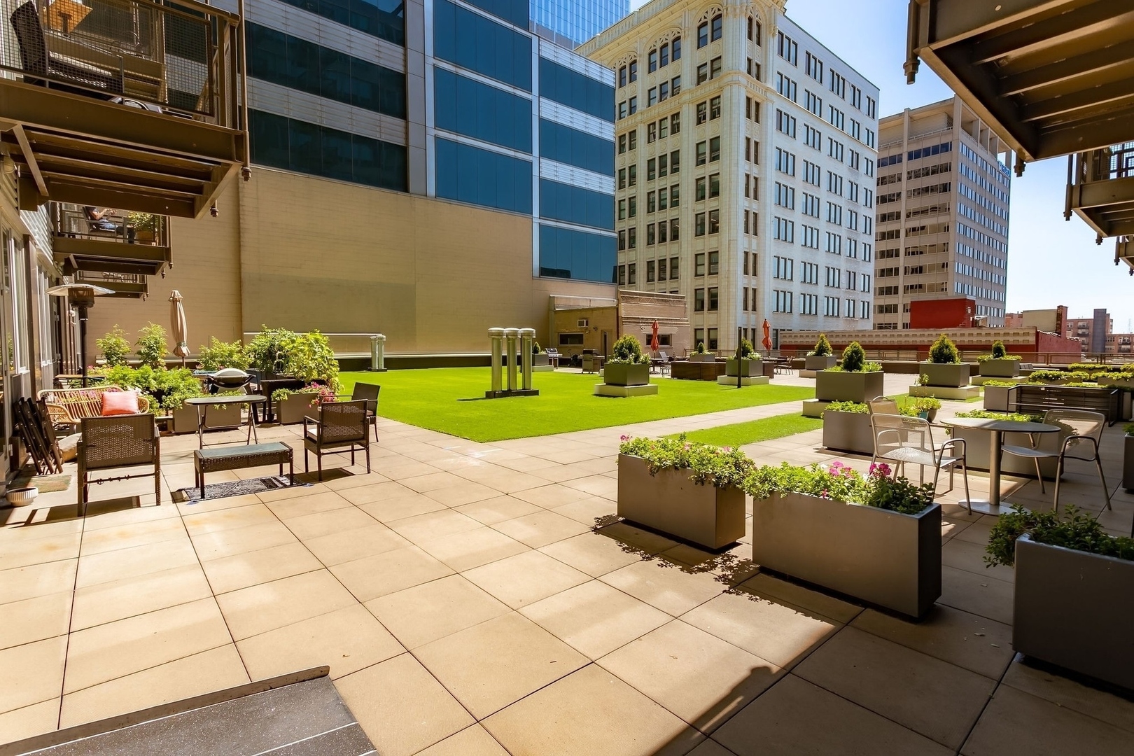 565 West Quincy Street, Unit 902 Chicago, IL 60661 - Photo 17 of 26 a building outdoor space with patio furniture and garden