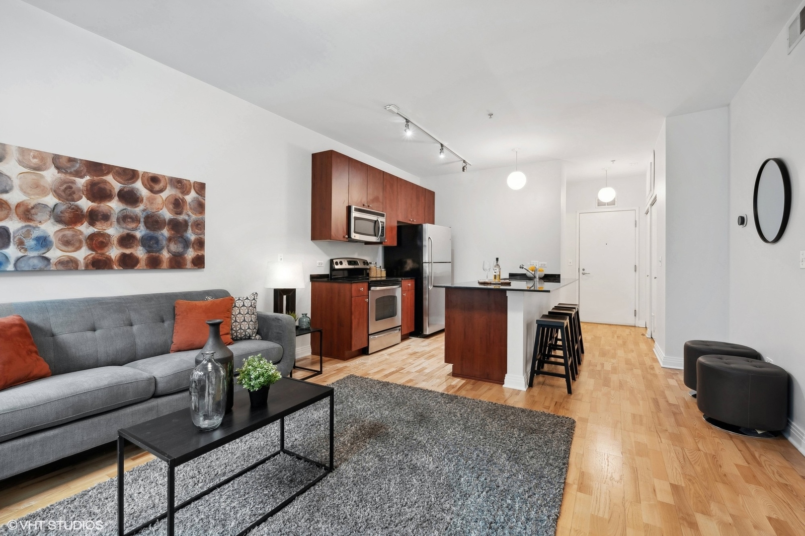 565 West Quincy Street, Unit 902 Chicago, IL 60661 - Photo 7 of 26 a living room with furniture