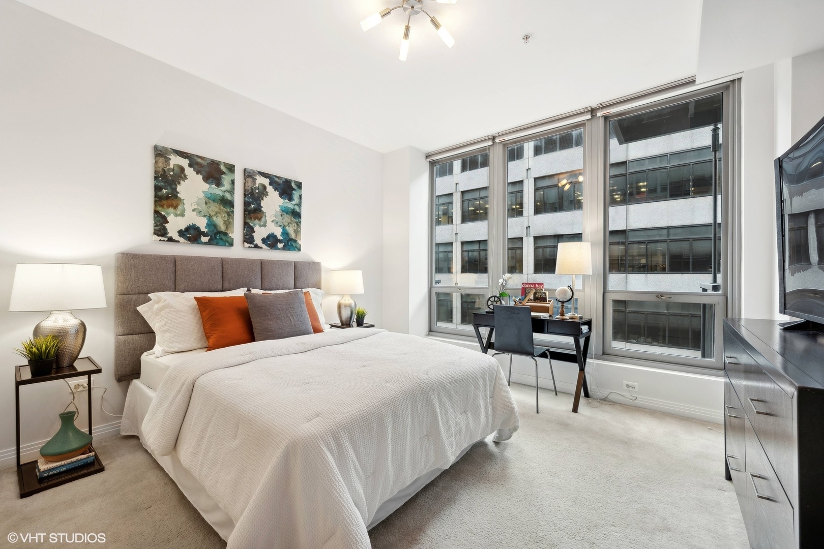 565 West Quincy Street, Unit 902 Chicago, IL 60661 - Photo 9 of 26 a bedroom with a bed and a cabinets