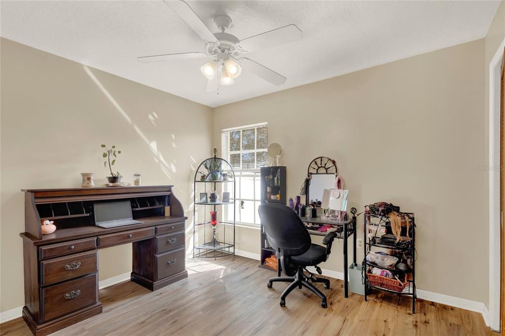 1007 Tony Circle St. Cloud, FL 34772 - Photo 15 of 20 a view of a workspace with furniture and a window