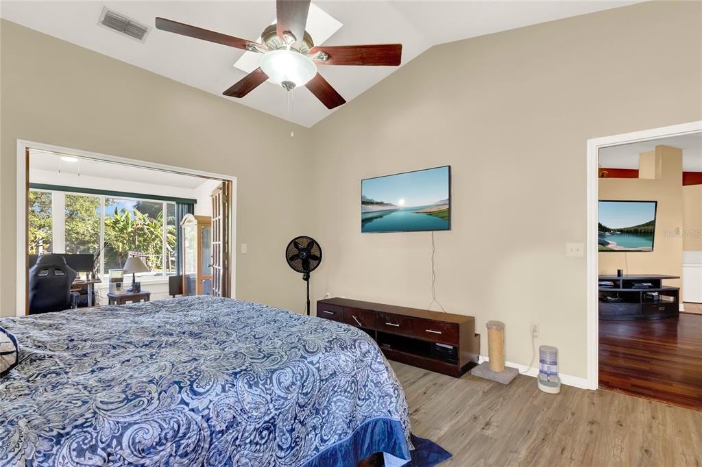 1007 Tony Circle St. Cloud, FL 34772 - Photo 10 of 20 a bed room with a bed and a chandelier