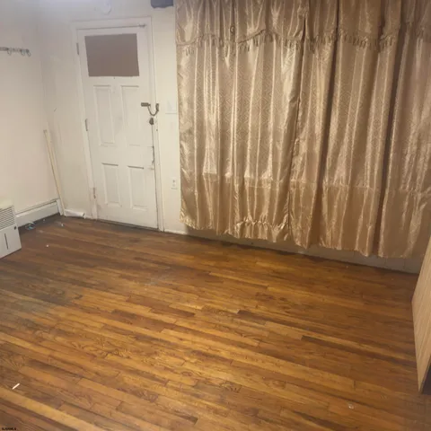 a view of wooden floor and staircase