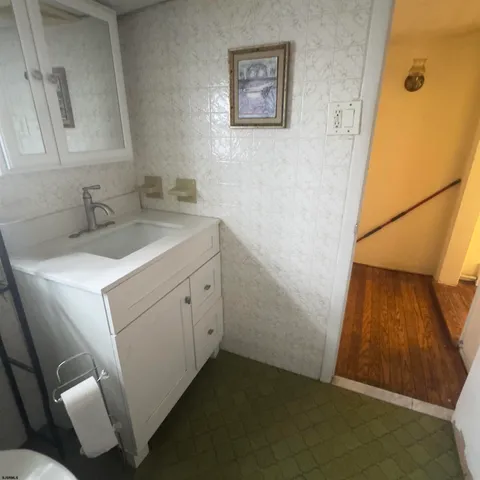 a bathroom with a sink and a mirror