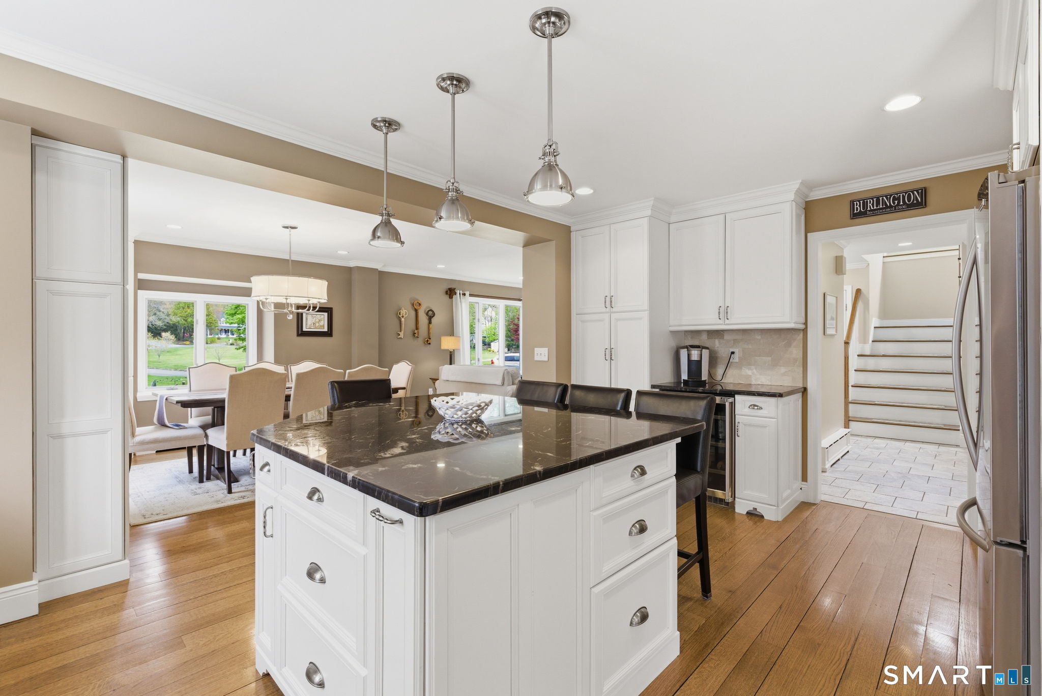 10 Ryans Way Burlington, CT 06013 - Photo 12 of 35 a kitchen with stainless steel appliances granite countertop a sink stove and wooden floor