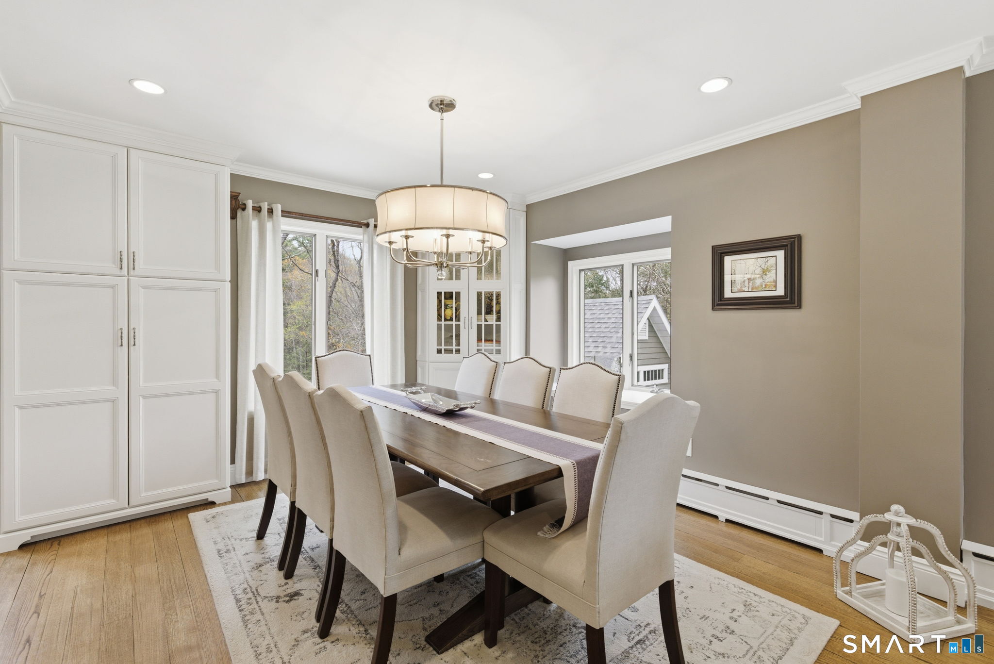 10 Ryans Way Burlington, CT 06013 - Photo 13 of 35 a view of a dining room with furniture window and wooden floor
